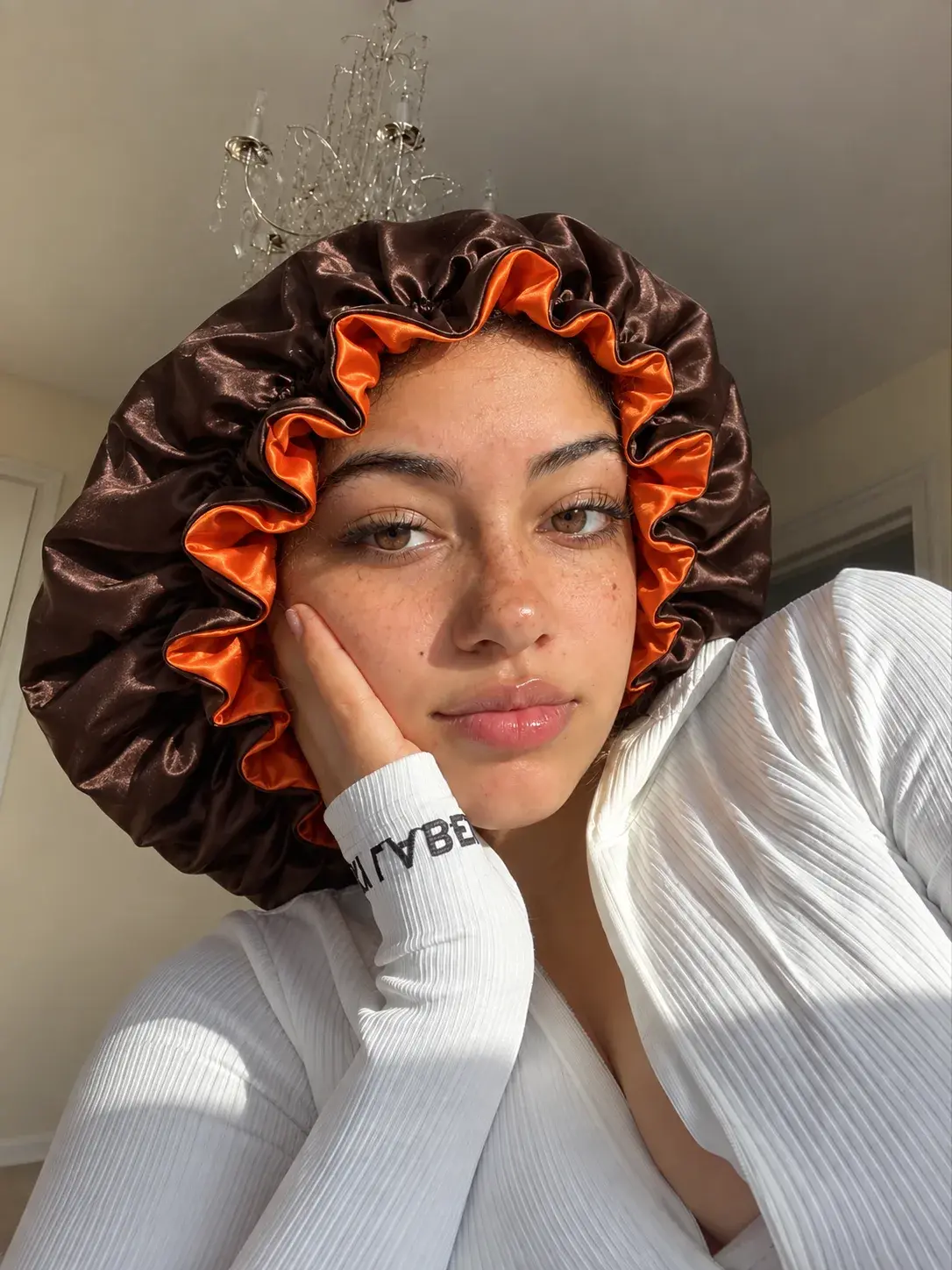 Chocolate satin bonnet with tangerine lining